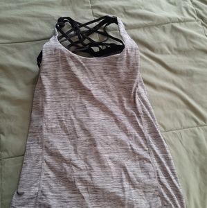 Workout tank with built in strappy bra